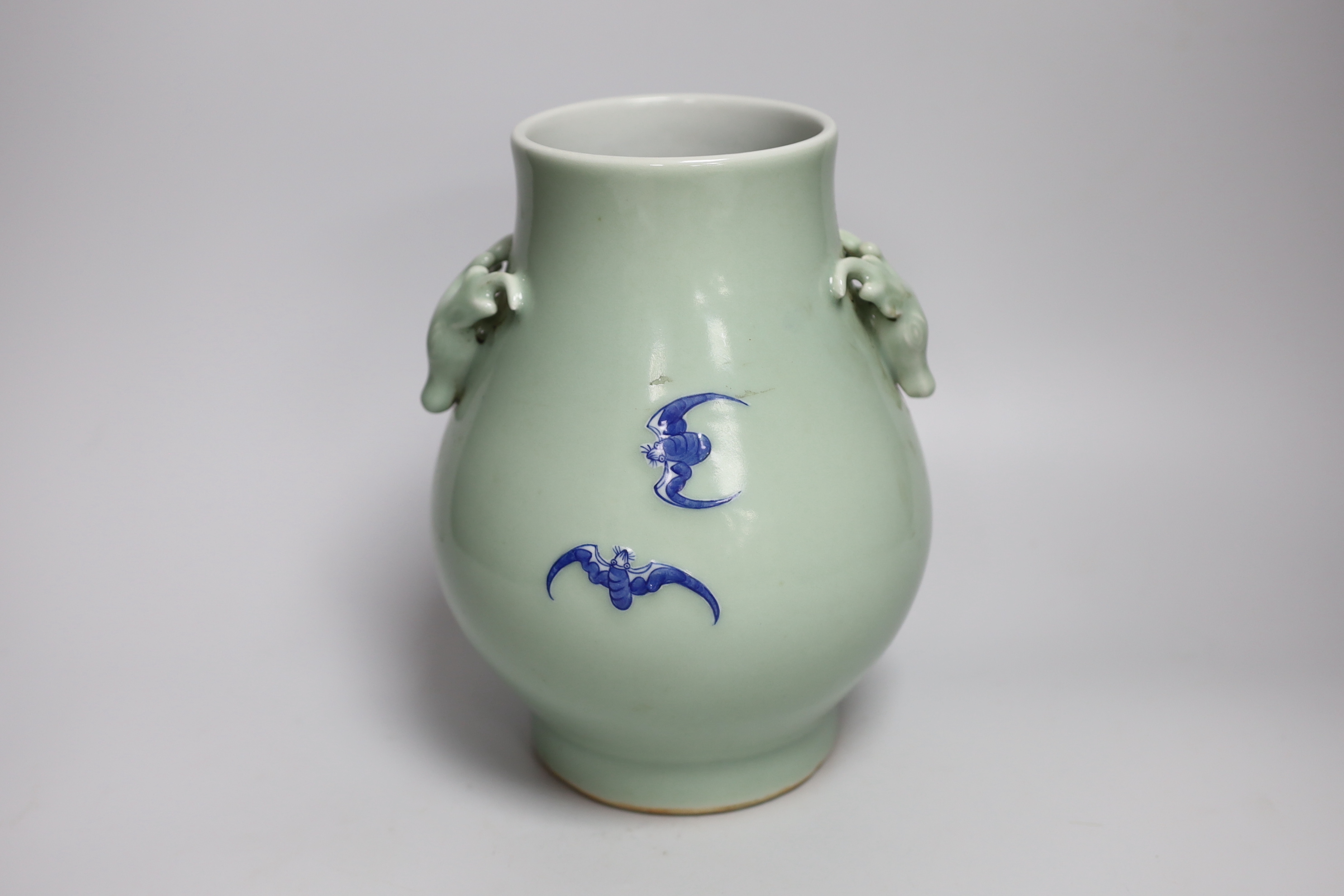 A Chinese underglaze blue and slip decorated celadon ground celadon vase, hu, 23cm high